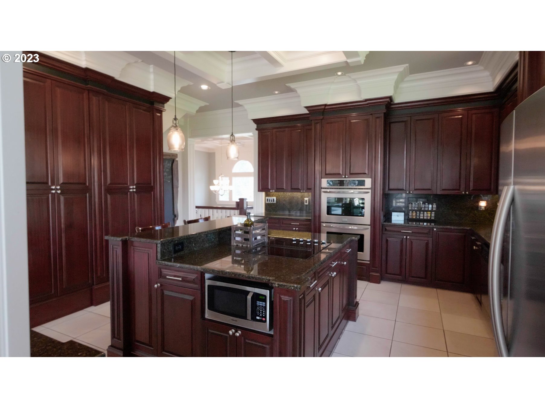 14976 South Hoffman Road Oregon City, OR 97045 - Photo 7 of 26 a kitchen with stainless steel appliances granite countertop a stove refrigerator and cabinets