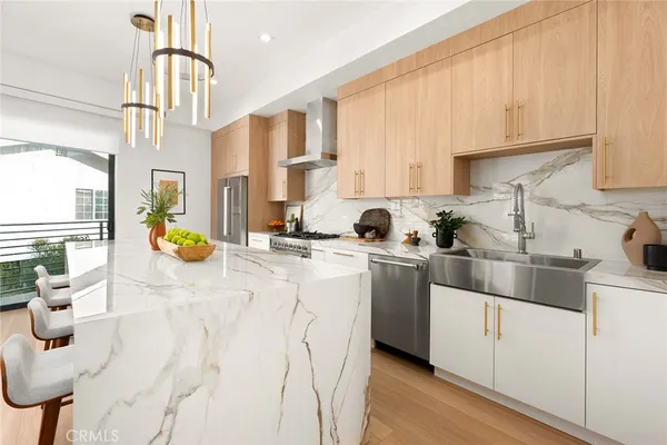 a kitchen with cabinets and window