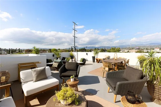 a couch sitting on a table near an ocean