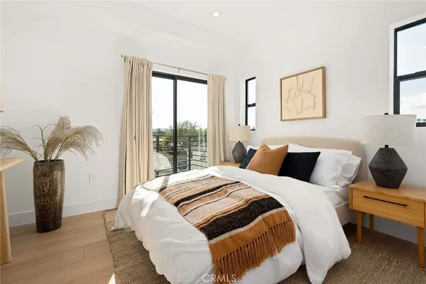 a bedroom with bed and a window