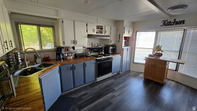 1500 Angel Street North, Unit 53 Layton, UT 84041 - Photo 8 of 20 Kitchen featuring wood-finish countertops, dual-tone cabinetry, stainless steel sink, gas range, and wood-finish flooring