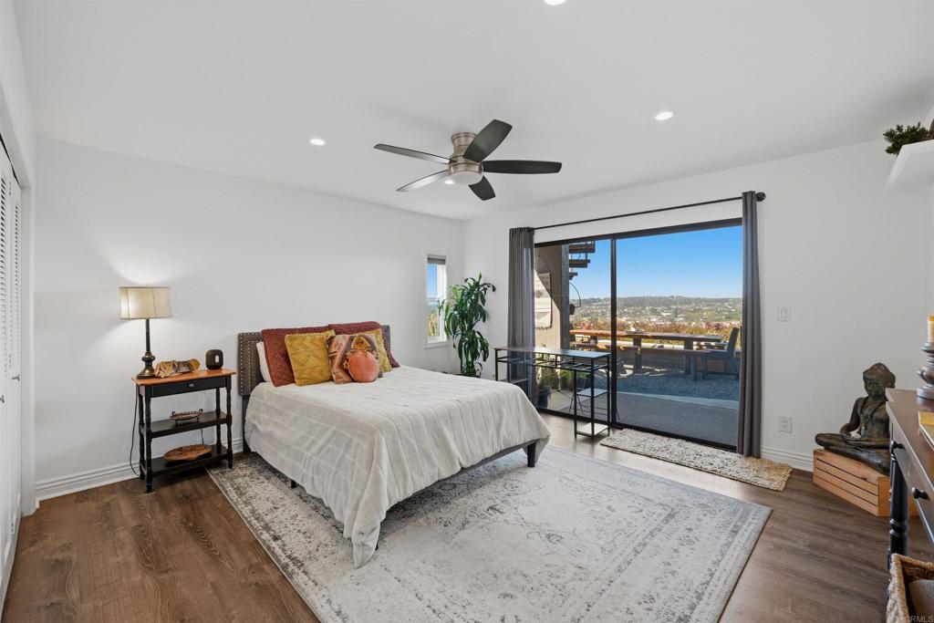 2414 Sacada Circle Carlsbad, CA 92009 - Photo 26 of 56 a bedroom with a bed and a large window