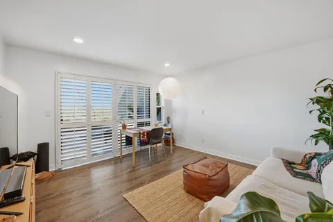 a kitchen with stainless steel appliances a sink a refrigerator and cabinets