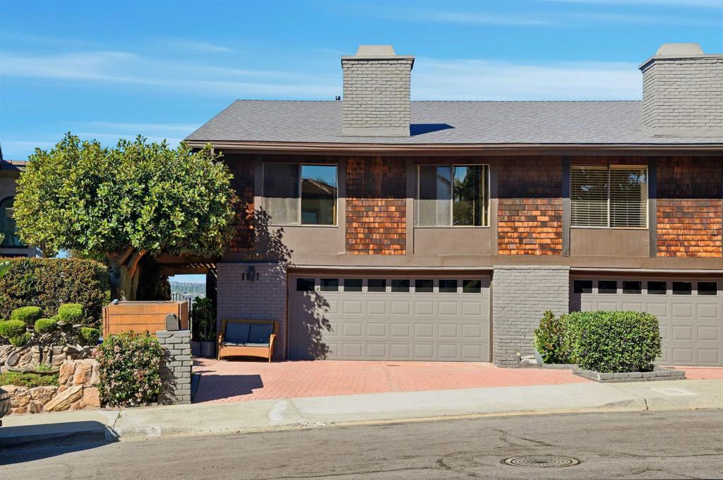 2414 Sacada Circle Carlsbad, CA 92009 - Photo 3 of 56 a front view of a house with yard