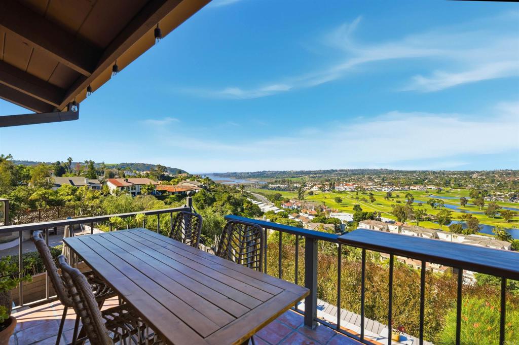 2414 Sacada Circle Carlsbad, CA 92009 - Photo 39 of 56 a view of a balcony with wooden chairs