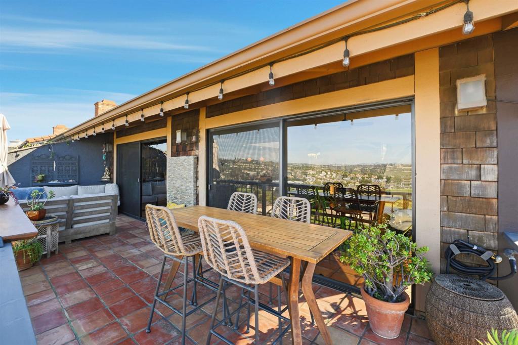 2414 Sacada Circle Carlsbad, CA 92009 - Photo 40 of 56 a view of a chairs and table in the patio