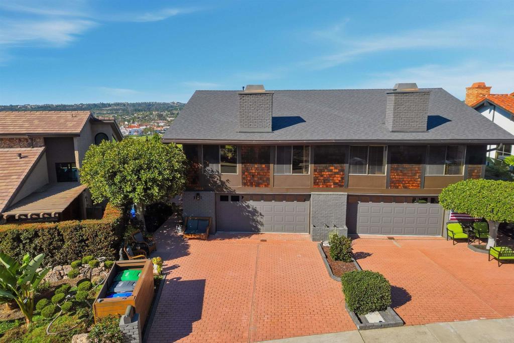 2414 Sacada Circle Carlsbad, CA 92009 - Photo 42 of 56 a front view of a house with a patio
