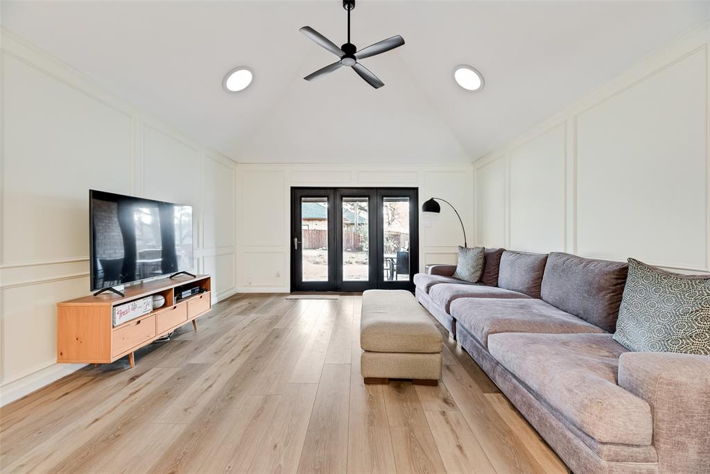 740 Newport Road Fort Worth, TX 76120 - Photo 15 of 38 a living room with furniture flat screen tv and a large window