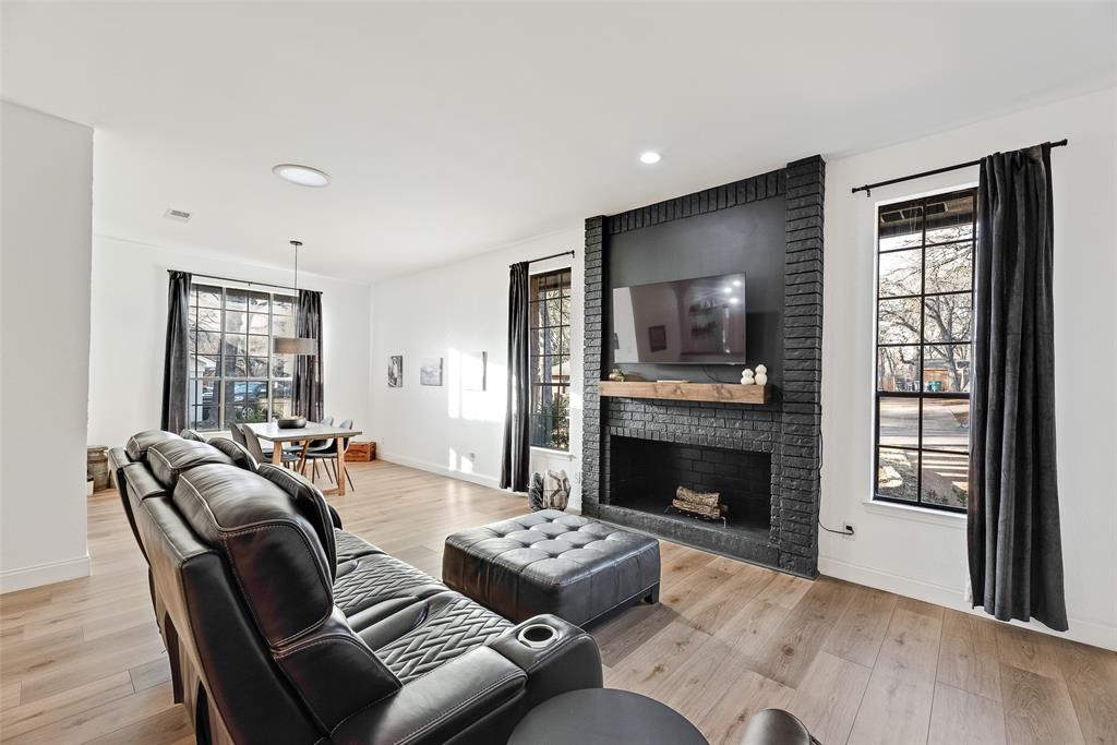 740 Newport Road Fort Worth, TX 76120 - Photo 2 of 38 a living room with furniture and a fireplace