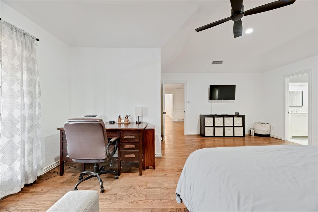 740 Newport Road Fort Worth, TX 76120 - Photo 21 of 38 a bedroom with furniture and a window