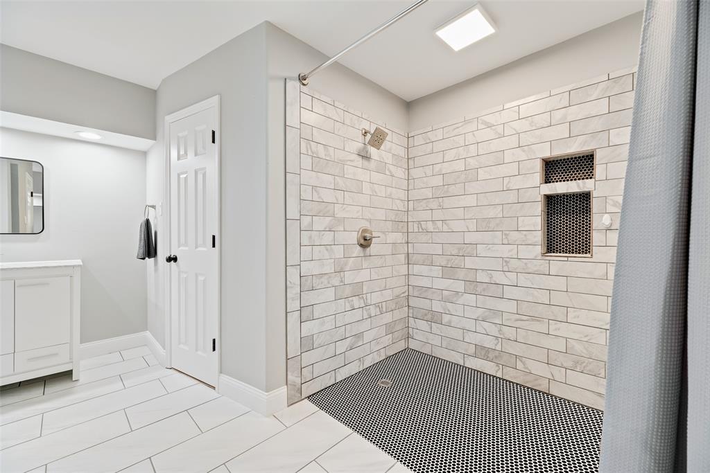 740 Newport Road Fort Worth, TX 76120 - Photo 23 of 38 a bathroom with a shower