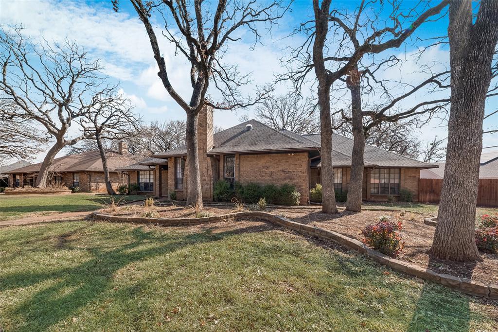 740 Newport Road Fort Worth, TX 76120 - Photo 38 of 38 a backyard of a house with table and chairs