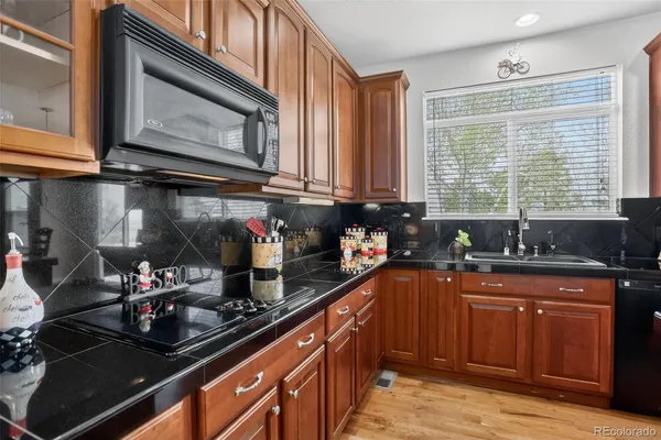 a workspace with wooden floor and a window