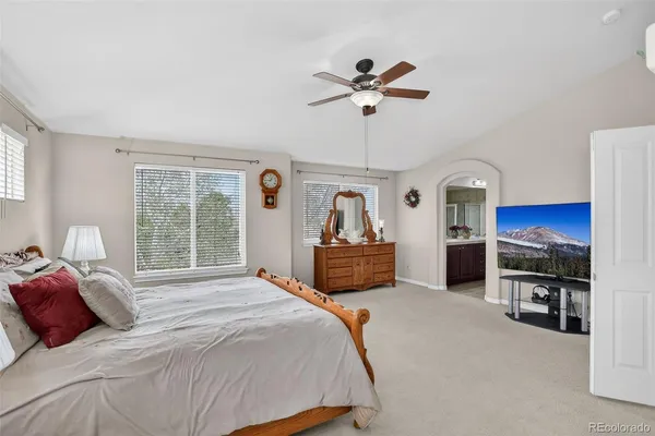 a bedroom with furniture and a fireplace