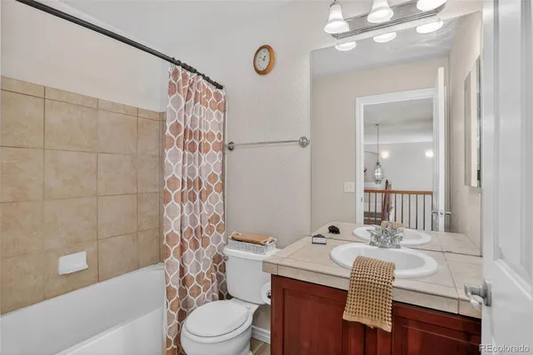 a bathroom with a sink a mirror and a toilet