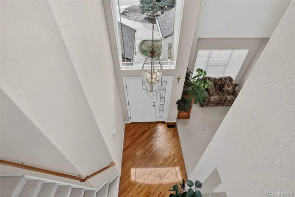 a view of a livingroom with furniture and a potted plant