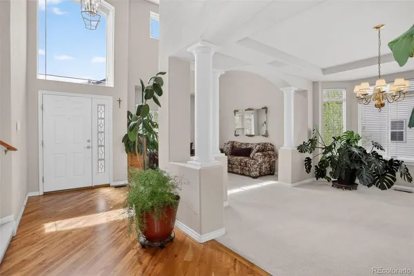 a view of a hallway with paintings on the wall