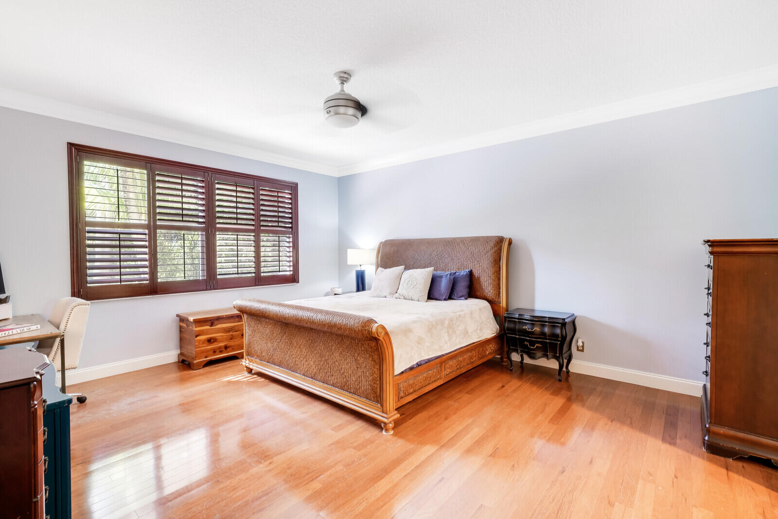 202 Anhinga Lane Jupiter, FL 33458 - Photo 21 of 40 a bedroom with a bed and a window