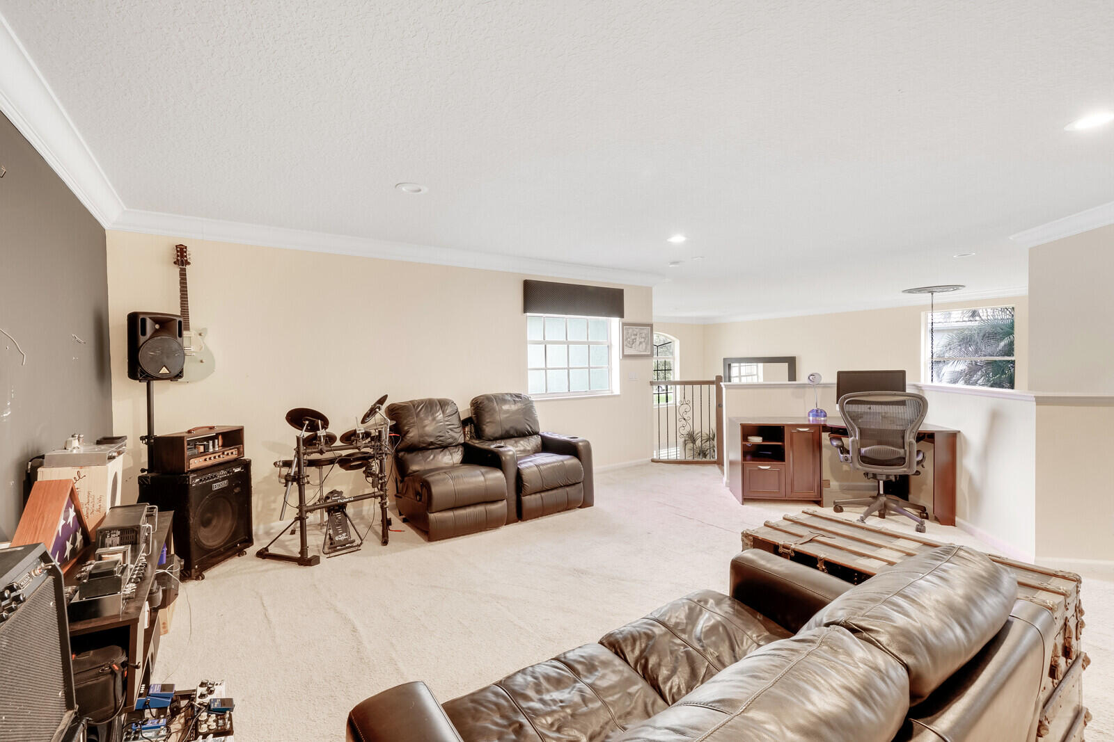 202 Anhinga Lane Jupiter, FL 33458 - Photo 28 of 40 a living room with furniture kitchen view and a flat screen tv