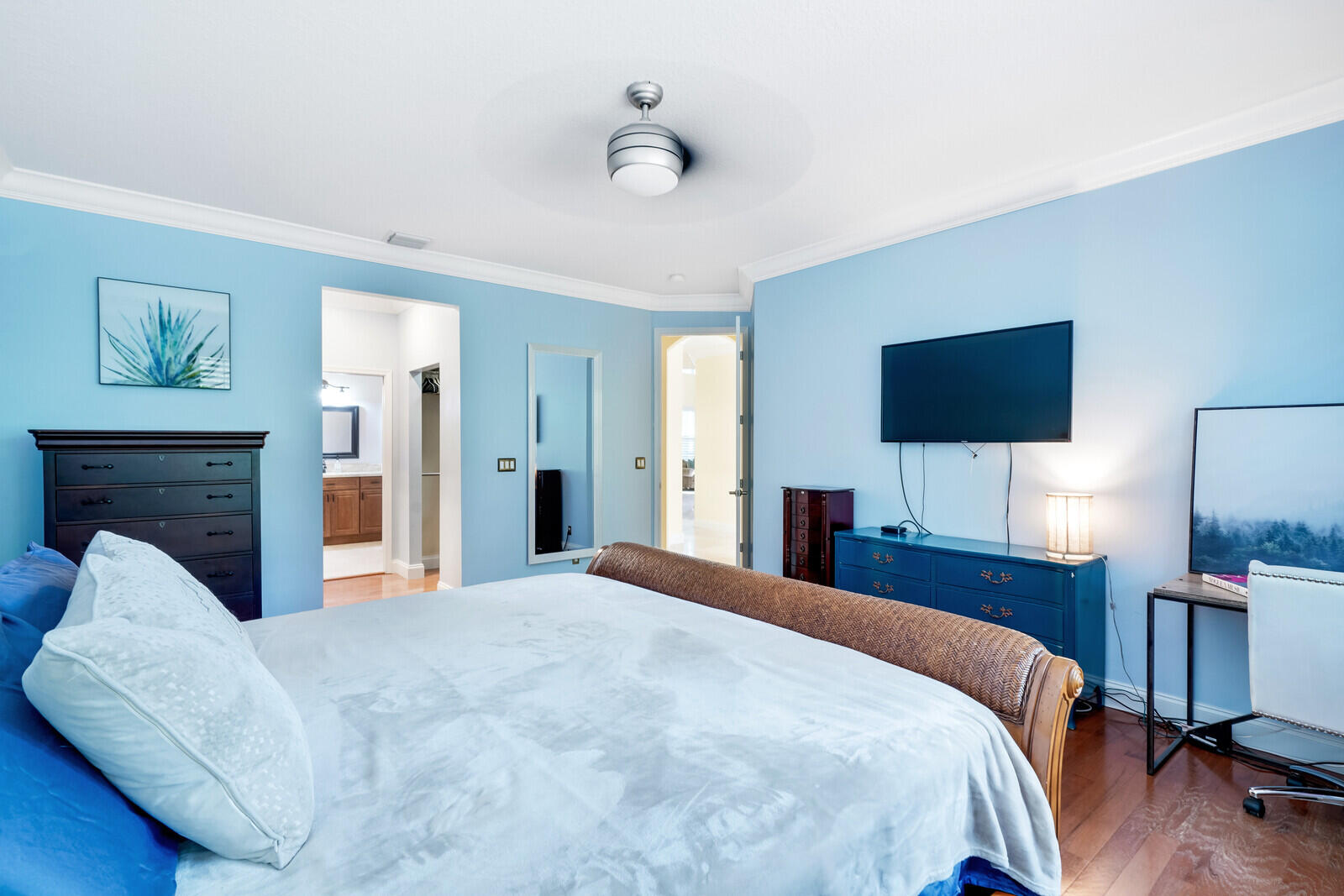 202 Anhinga Lane Jupiter, FL 33458 - Photo 31 of 40 a bedroom with a bed and a flat screen tv