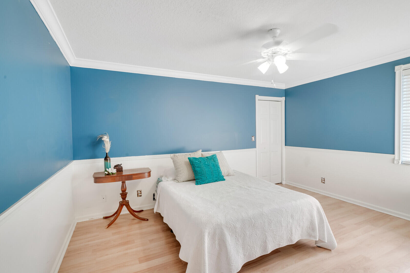 202 Anhinga Lane Jupiter, FL 33458 - Photo 32 of 40 a bedroom with a bed and chandelier