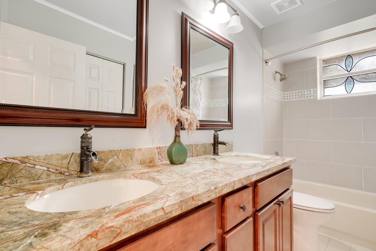 202 Anhinga Lane Jupiter, FL 33458 - Photo 33 of 40 a bathroom with a granite countertop sink and a mirror