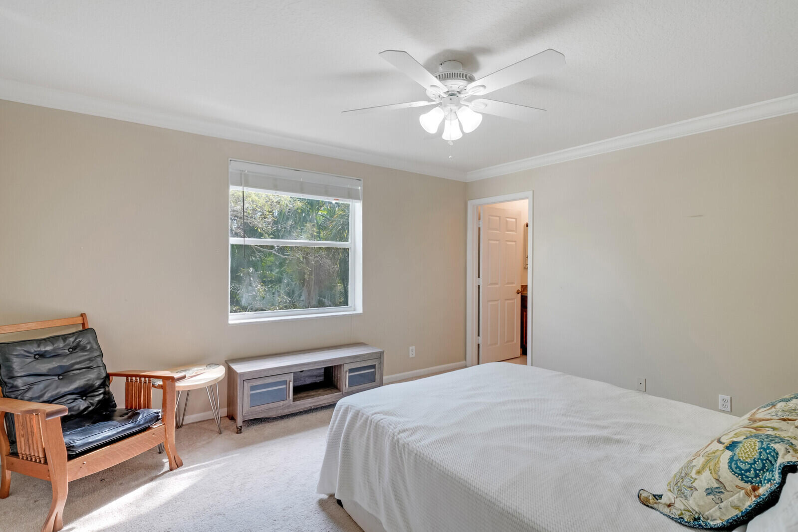 202 Anhinga Lane Jupiter, FL 33458 - Photo 34 of 40 a bedroom with bed and window