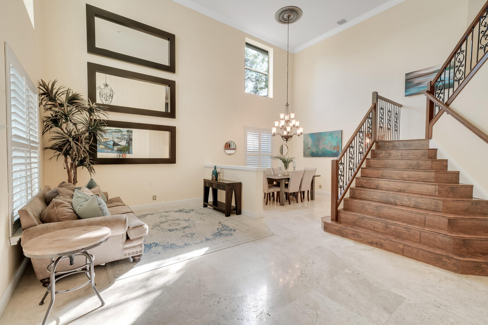 202 Anhinga Lane Jupiter, FL 33458 - Photo 6 of 40 a living room with furniture and a chandelier