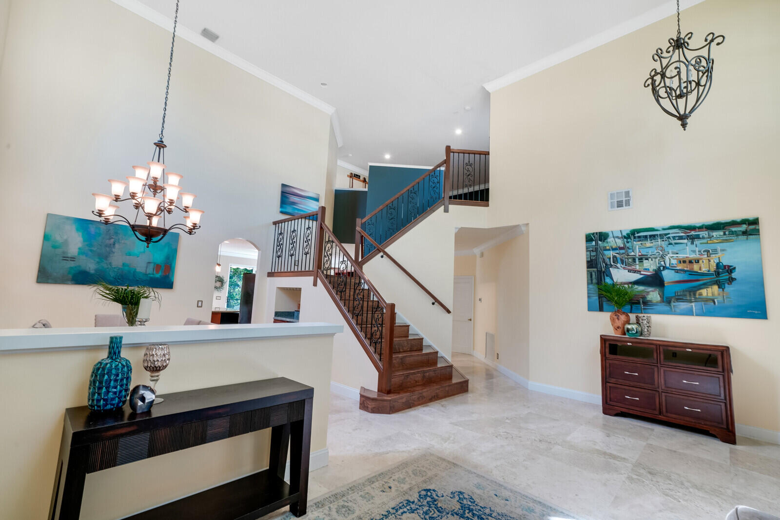 202 Anhinga Lane Jupiter, FL 33458 - Photo 8 of 40 a living room with furniture and a chandelier