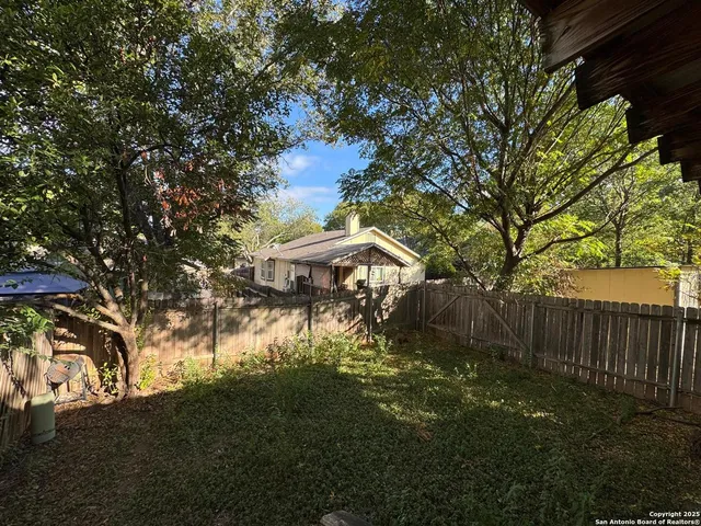 a view of backyard with green space