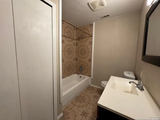 a bathroom with a sink and a bathtub