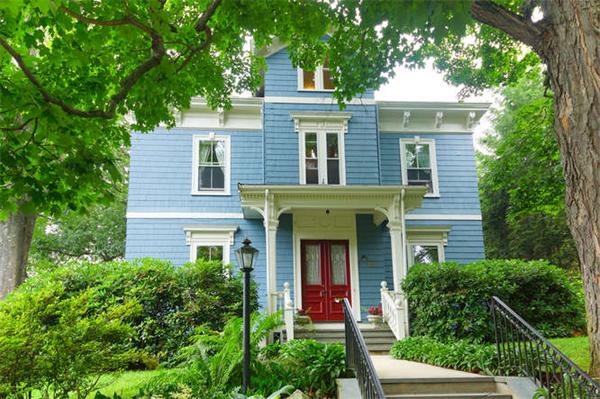 front view of a house with a yard