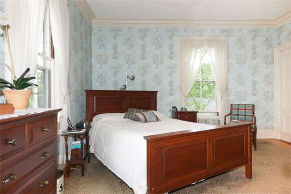 42 Rangeley Road Winchester, MA 01890 - Photo 16 of 30 a room with a bed and a potted plant on dresser