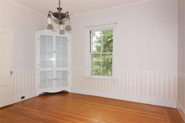42 Rangeley Road Winchester, MA 01890 - Photo 23 of 30 an empty room with wooden floor cabinet and windows
