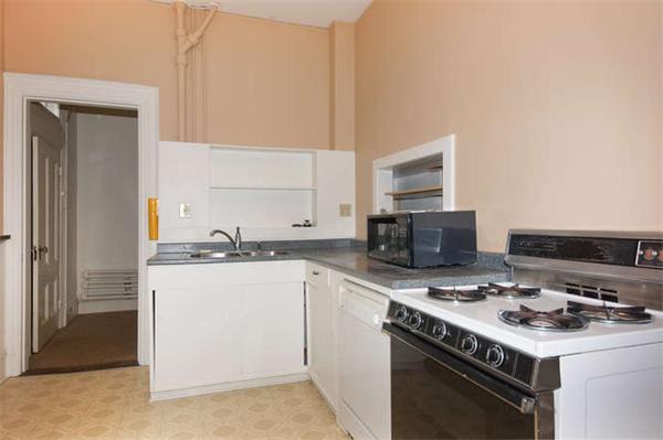 42 Rangeley Road Winchester, MA 01890 - Photo 24 of 30 a kitchen with a stove and a microwave