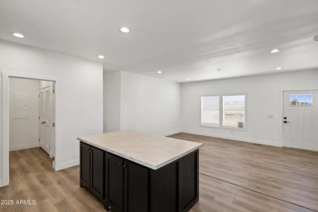 a kitchen with a refrigerator a sink and a stove