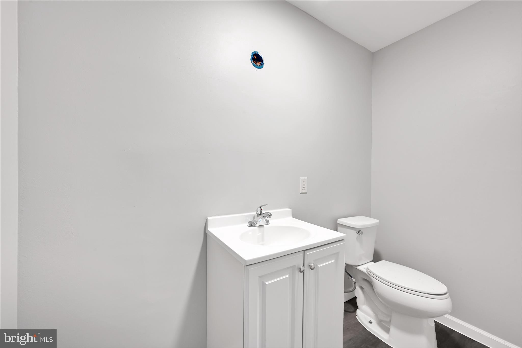 2509 Mill Road Mechanicsburg, PA 17055 - Photo 20 of 43 a bathroom with a sink a toilet and mirror