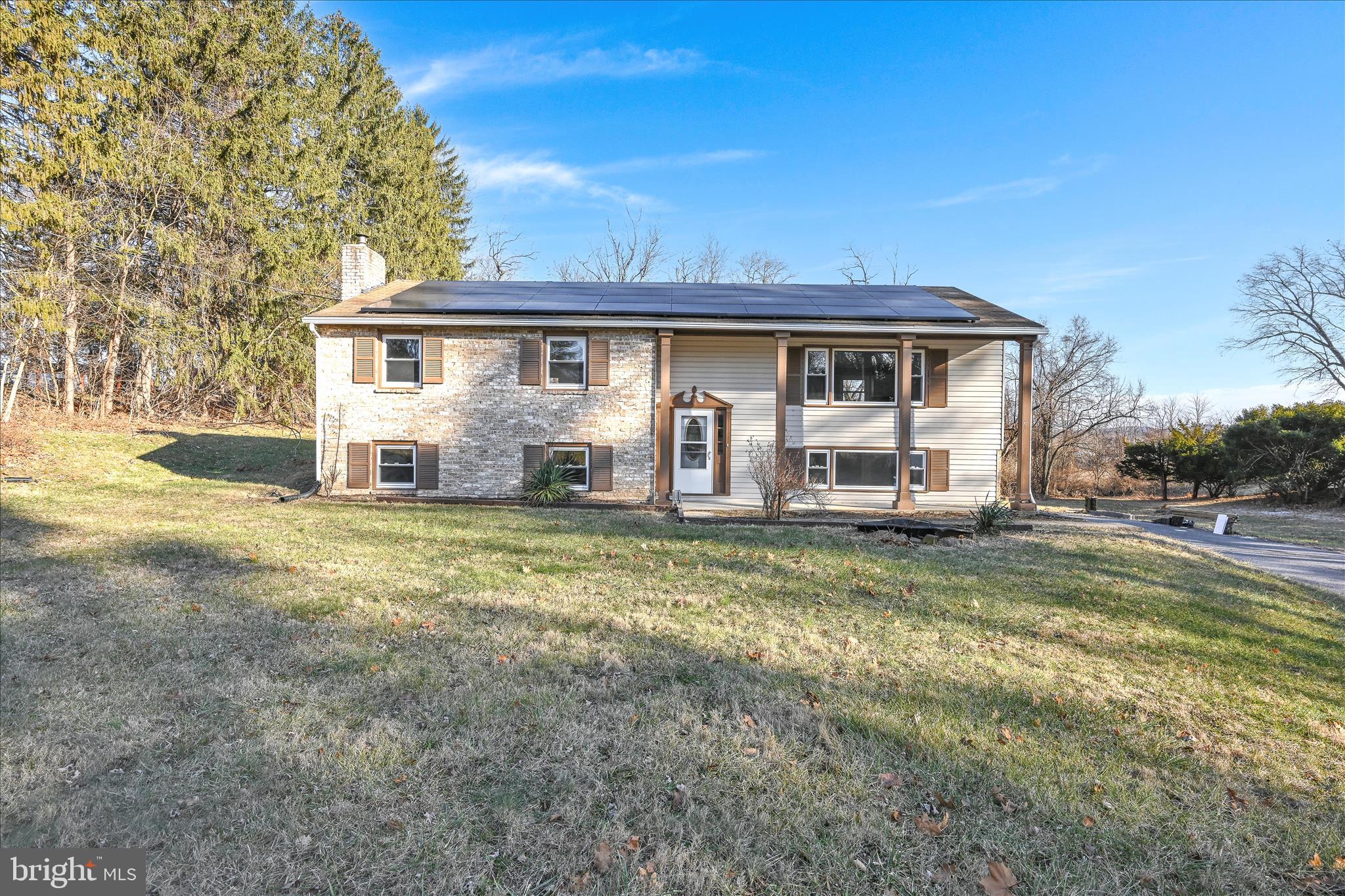 2509 Mill Road Mechanicsburg, PA 17055 - Photo 2 of 43 a view of a yard in front of a house with large trees