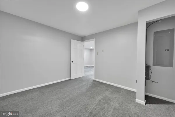 a view of an empty room and closet area