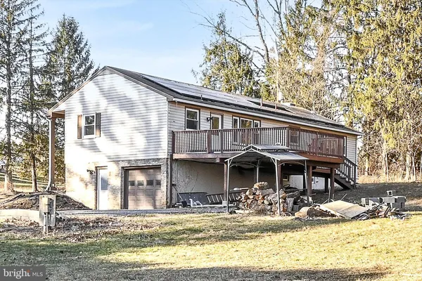 a front view of a house with swimming pool