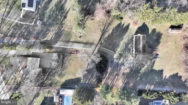 a view of pathway with a building in the background