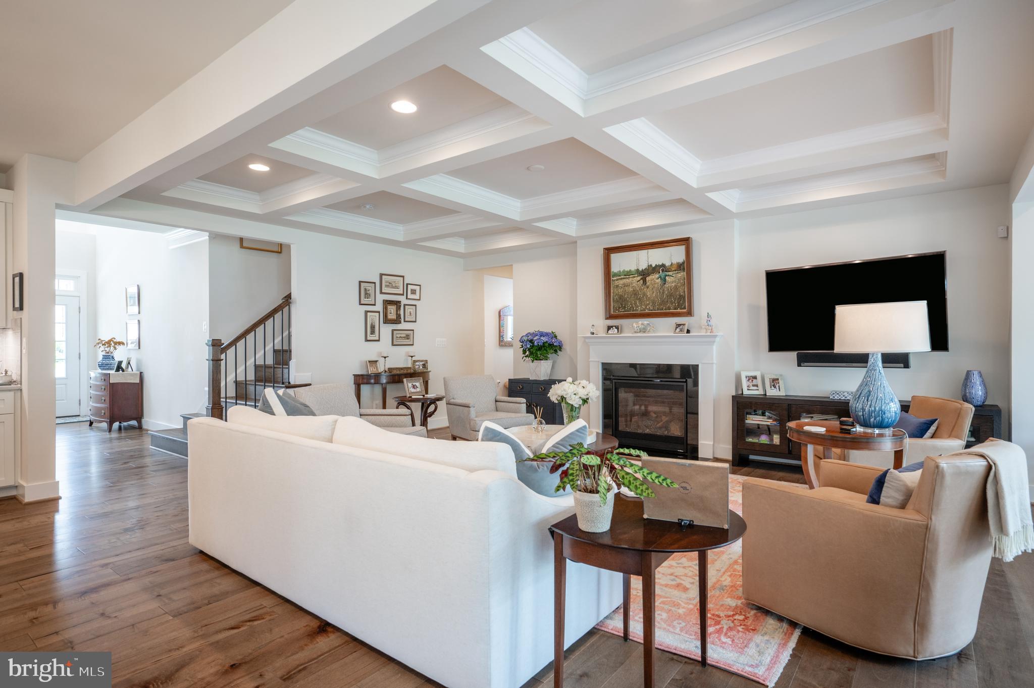 6233 McConnell Lane Springfield, VA 22152 - Photo 14 of 58 a living room with furniture a fireplace and a flat screen tv
