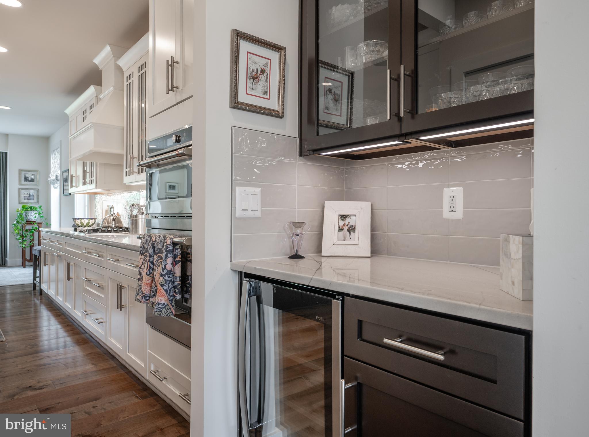 6233 McConnell Lane Springfield, VA 22152 - Photo 20 of 58 a kitchen with stainless steel appliances granite countertop a sink and cabinets