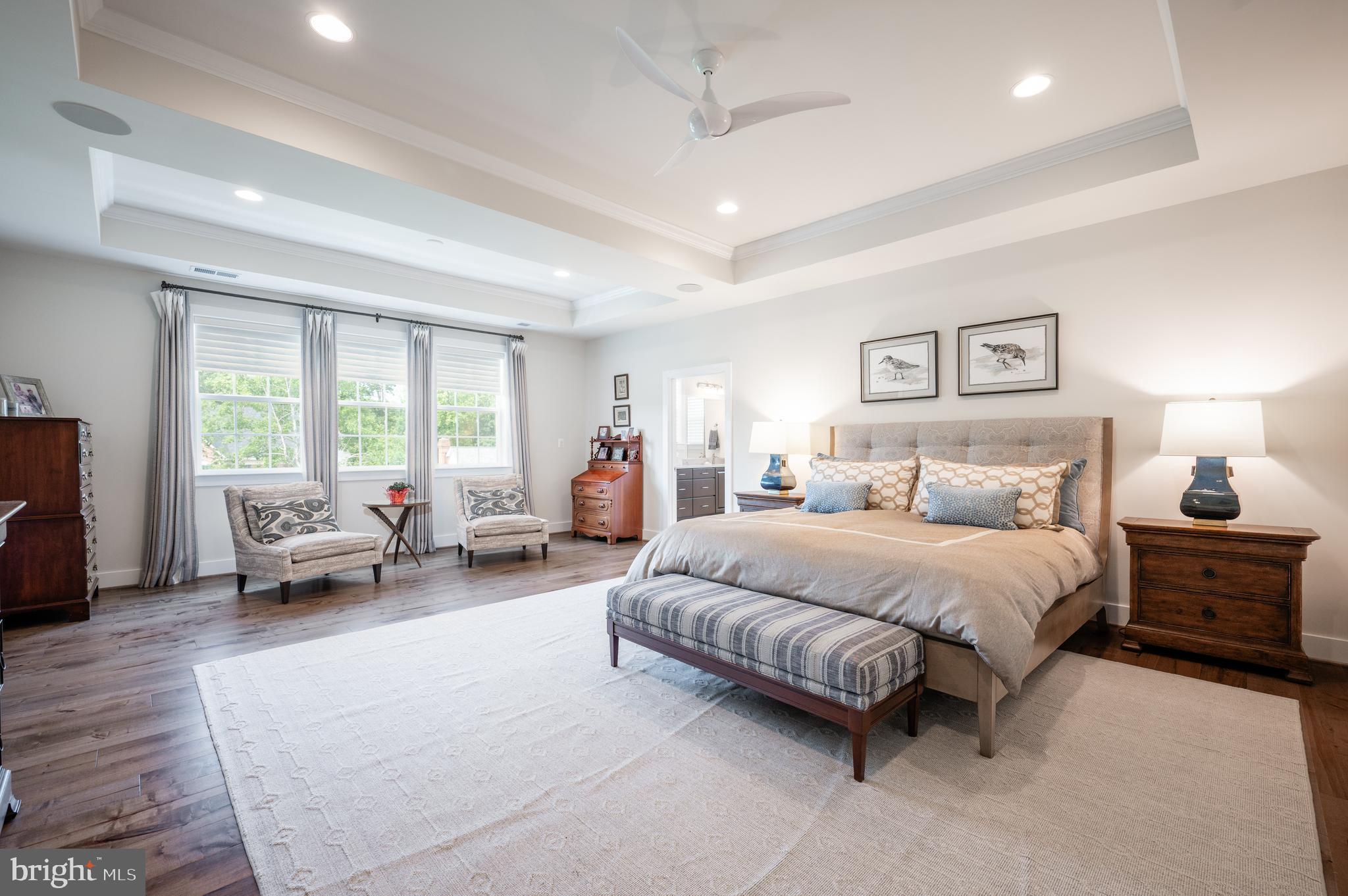 6233 McConnell Lane Springfield, VA 22152 - Photo 28 of 58 a spacious bedroom with a bed and furniture