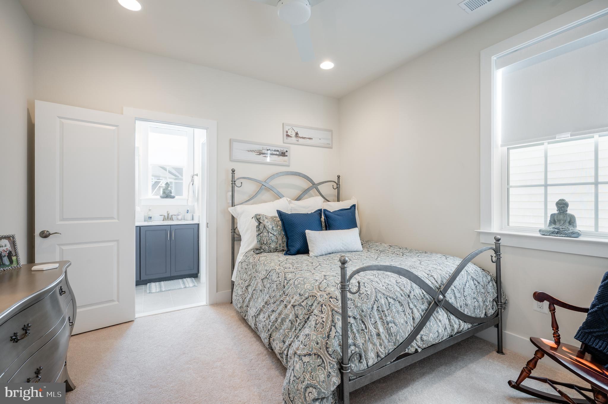 6233 McConnell Lane Springfield, VA 22152 - Photo 35 of 58 a bedroom with a large bed and a chandelier