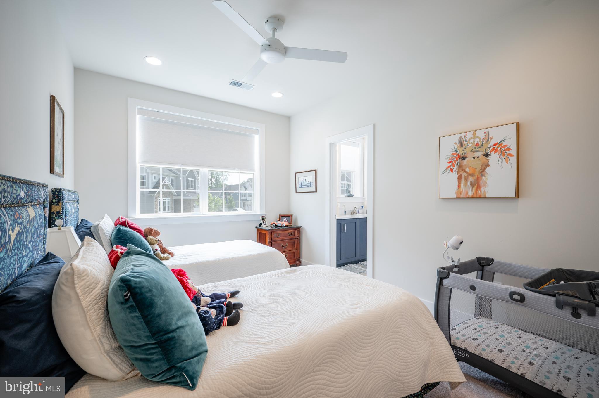 6233 McConnell Lane Springfield, VA 22152 - Photo 38 of 58 a bedroom with a bed a couch and a window
