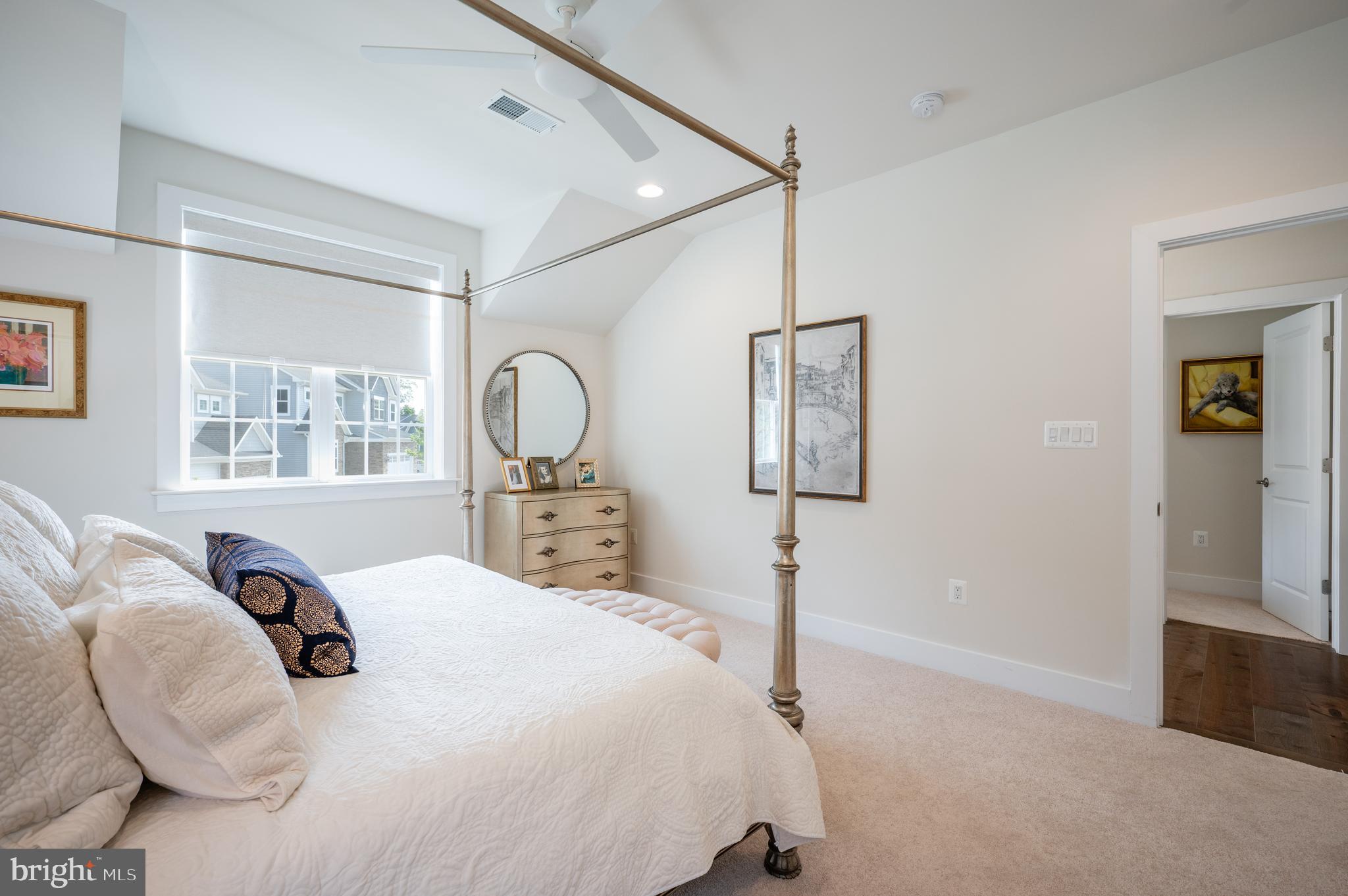 6233 McConnell Lane Springfield, VA 22152 - Photo 40 of 58 a bedroom with a bed and wooden floor