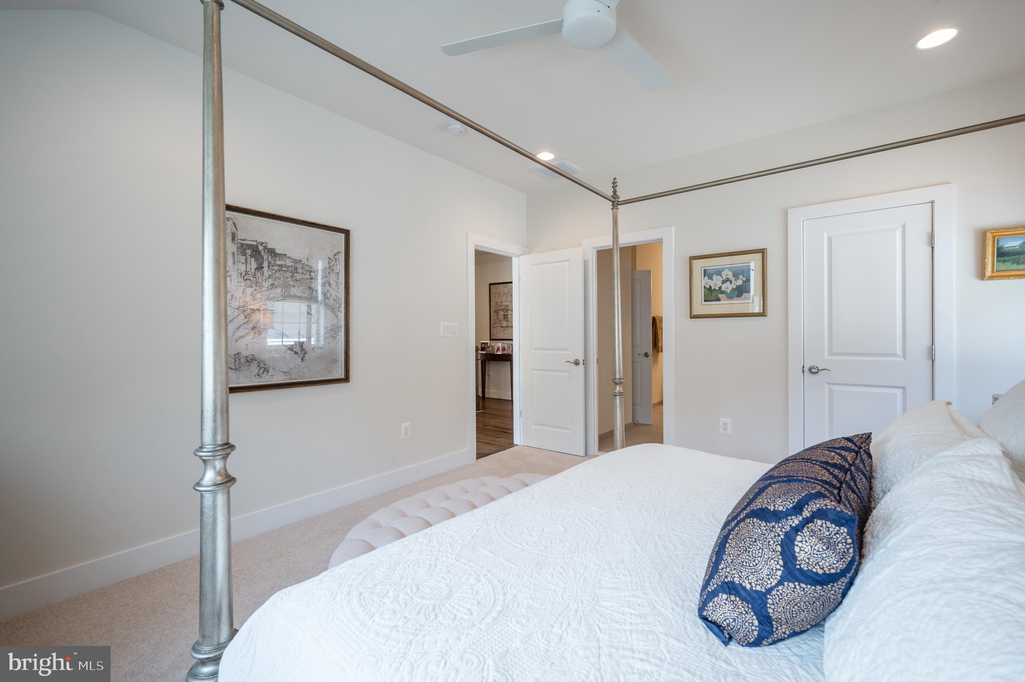 6233 McConnell Lane Springfield, VA 22152 - Photo 41 of 58 a bedroom with a large bed and a chandelier