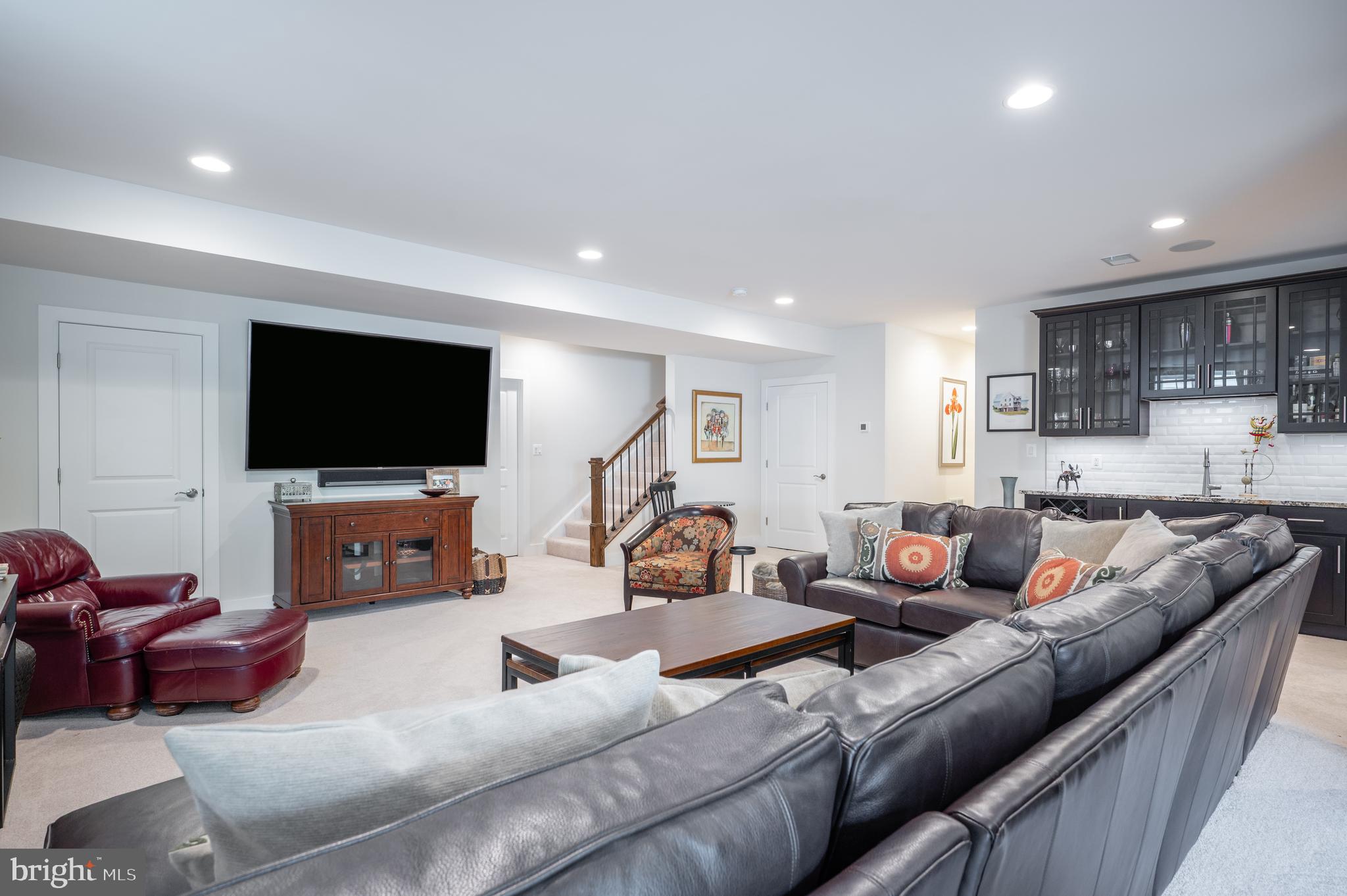 6233 McConnell Lane Springfield, VA 22152 - Photo 47 of 58 a living room with furniture and a flat screen tv