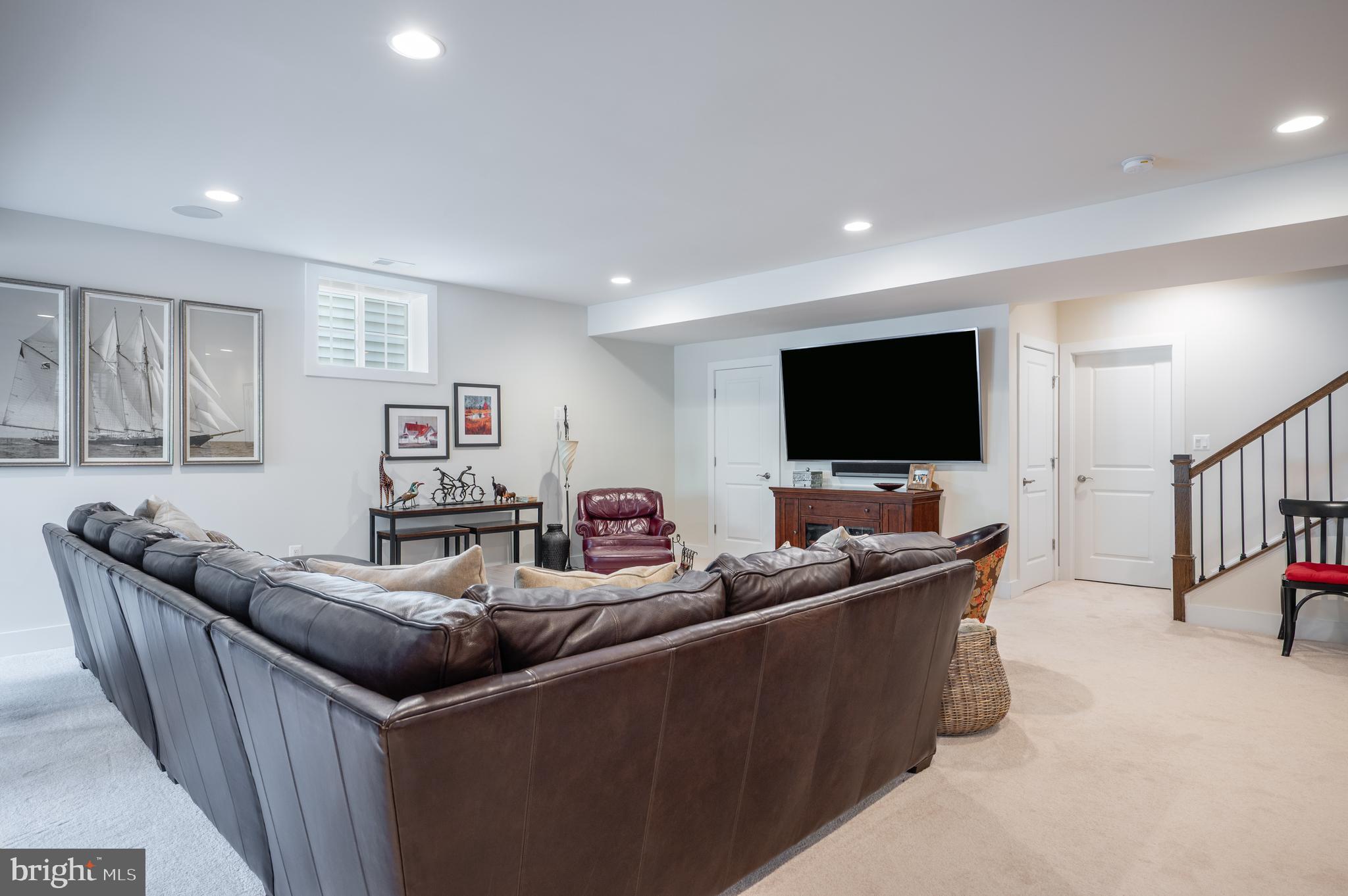 6233 McConnell Lane Springfield, VA 22152 - Photo 48 of 58 a living room with furniture and a flat screen tv